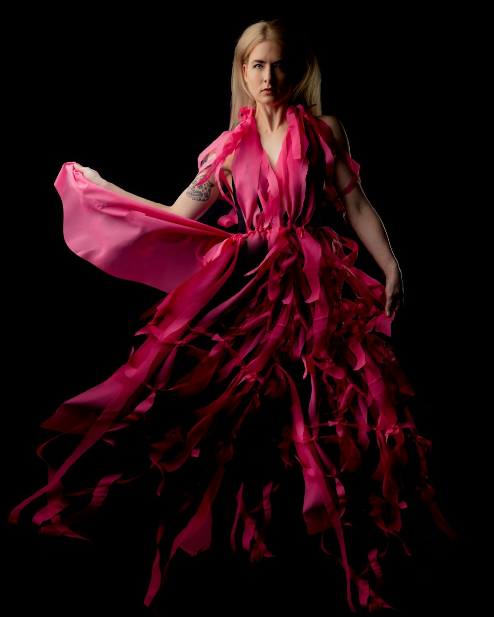 woman in pink sleeveless dress